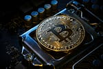 a bitcoin on top of a computer motherboard