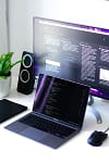 black and silver laptop computer beside black computer mouse