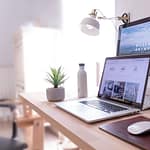 Voob.com.ng 58 MacBook Pro on table beside white iMac and Magic Mouse